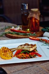 Baked perch fillet with rosemary and lemon with blanched vegetables
