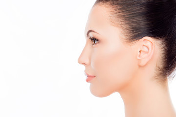 Side view portrait of attractive woman's face on white backgroun