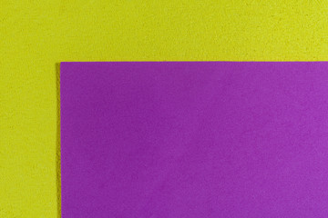 Fototapeta premium Eva foam ethylene vinyl acetate smooth pink surface on lemon yellow sponge plush background