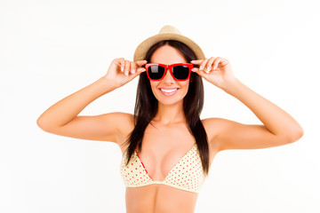 Happy girl with beaming smile in summer hat and glasses