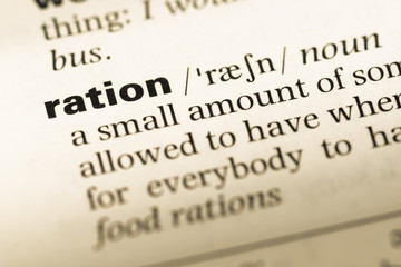 Close up of old English dictionary page with word ration