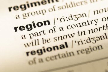 Obraz premium Close up of old English dictionary page with word region