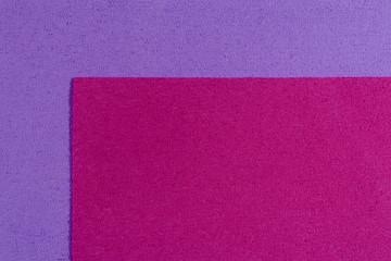 Fototapeta premium Eva foam ethylene vinyl acetate pink surface on light purple sponge plush background
