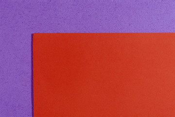 Fototapeta premium Eva foam ethylene vinyl acetate smooth orange surface on light purple sponge plush background