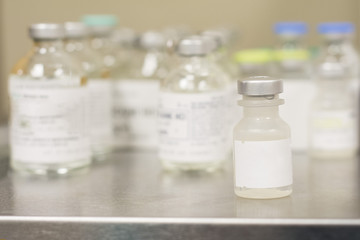 medical vials on table top in doctor office or medical office