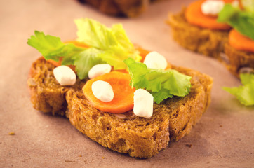 Healthy sandwich with carrots, celery and cheese