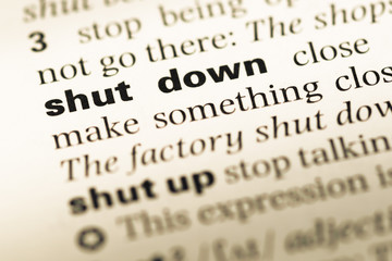 Fototapeta premium Close up of old English dictionary page with word shut down