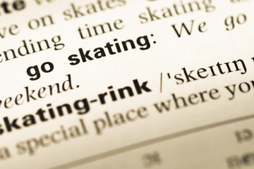 Close up of old English dictionary page with word go skating