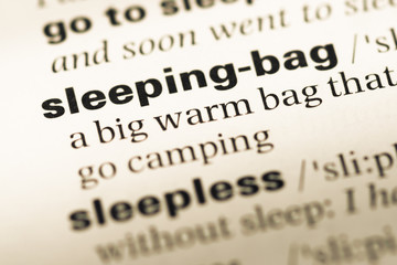 Obraz premium Close up of old English dictionary page with word sleeping bag