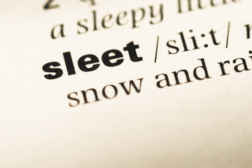 Close up of old English dictionary page with word sleet