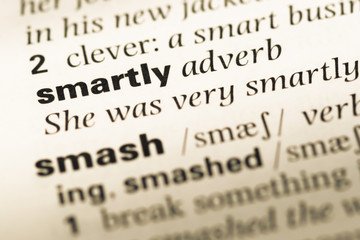Fototapeta premium Close up of old English dictionary page with word smartly