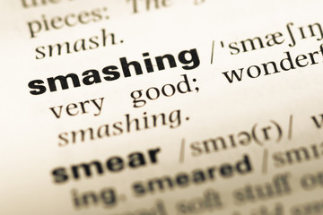 Obraz premium Close up of old English dictionary page with word smashing