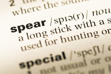Obraz premium Close up of old English dictionary page with word spear