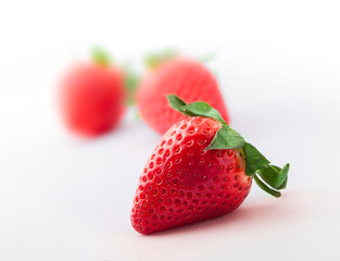 Strawberries group isolated on white