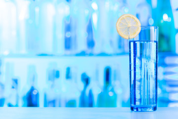 Glass with crystal water decorated by lemon slice