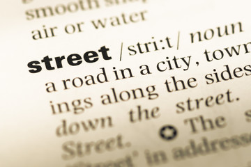 Fototapeta premium Close up of old English dictionary page with word street