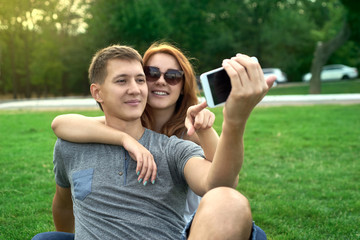 couple in love on the lawn makes self