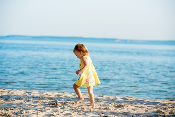 Fototapeta na wymiar girl walking on the beach