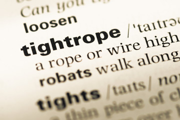 Obraz premium Close up of old English dictionary page with word tightrope
