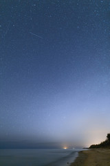 Clear night sky on the rocky beach