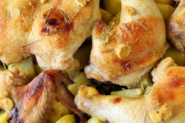 homemade baked jerk chicken with herbs and potatoes, background, pattern