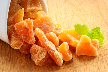 Closeup candied dried ginger in white bowl