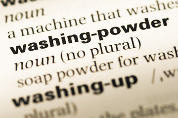 Obraz premium Close up of old English dictionary page with word washing powder