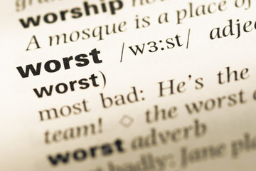 Close up of old English dictionary page with word worst