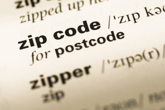 Close up of old English dictionary page with word zip code