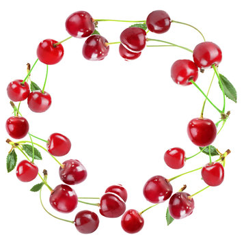 Round frame made of cherries isolated on white