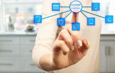 Using smart home app on virtual screen. Smart home control concept.