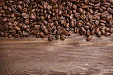 Coffee beans on wooden background