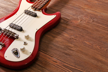 Fototapeta na wymiar Electric guitar on wooden background