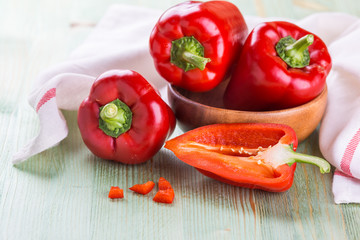Fresh organic bell peppers on a wooden board