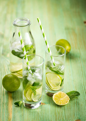 Lemonade drink on a wooden background