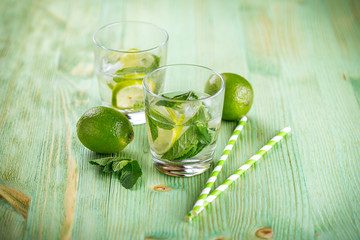 Lemonade drink on a wooden background