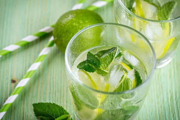 Lemonade drink on a wooden background