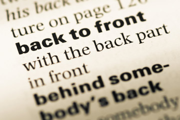 Close up of old English dictionary page with word back to front