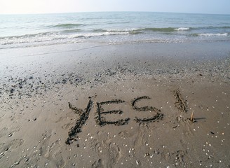 Great inscription written on the sand of the sea with the words