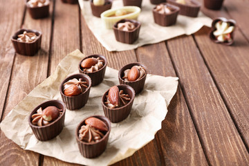 Chocolate sweets on wooden background
