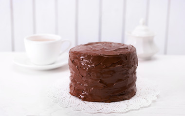 Tasty chocolate cake on light background