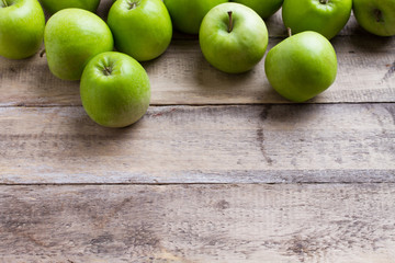 green apples on wood