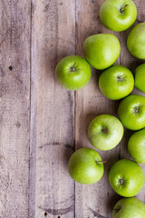 green apples on wood