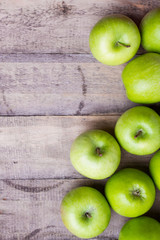 green apples on wood