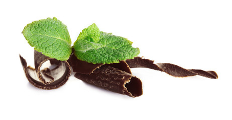 Milk chocolate chips with fresh mint, isolated on white