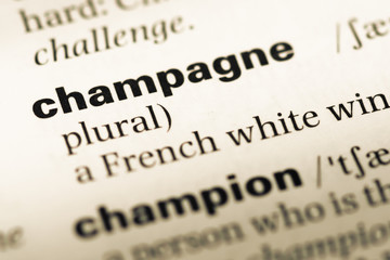 Close up of old English dictionary page with word champagne