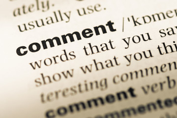 Obraz premium Close up of old English dictionary page with word comment