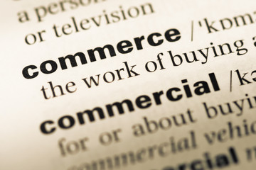 Fototapeta premium Close up of old English dictionary page with word commerce