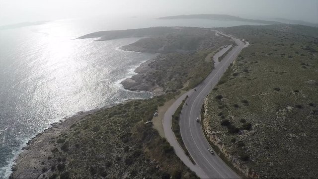 Aerial view of a coastal road during the afternoon.