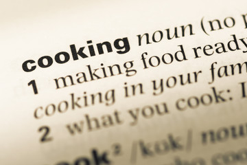 Close up of old English dictionary page with word cooking